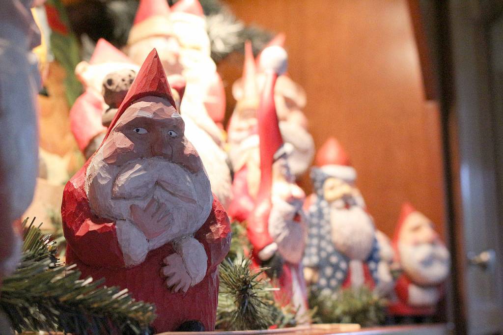 Phil Sedlacek has been carving Santas out of wood for over 40 years. Madison Miller/staff photos