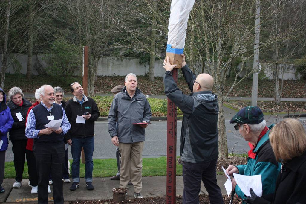 The peace pole is unveiled at Covenant Shores on Mercer Island on Jan. 18. Katie Metzger/staff photo
