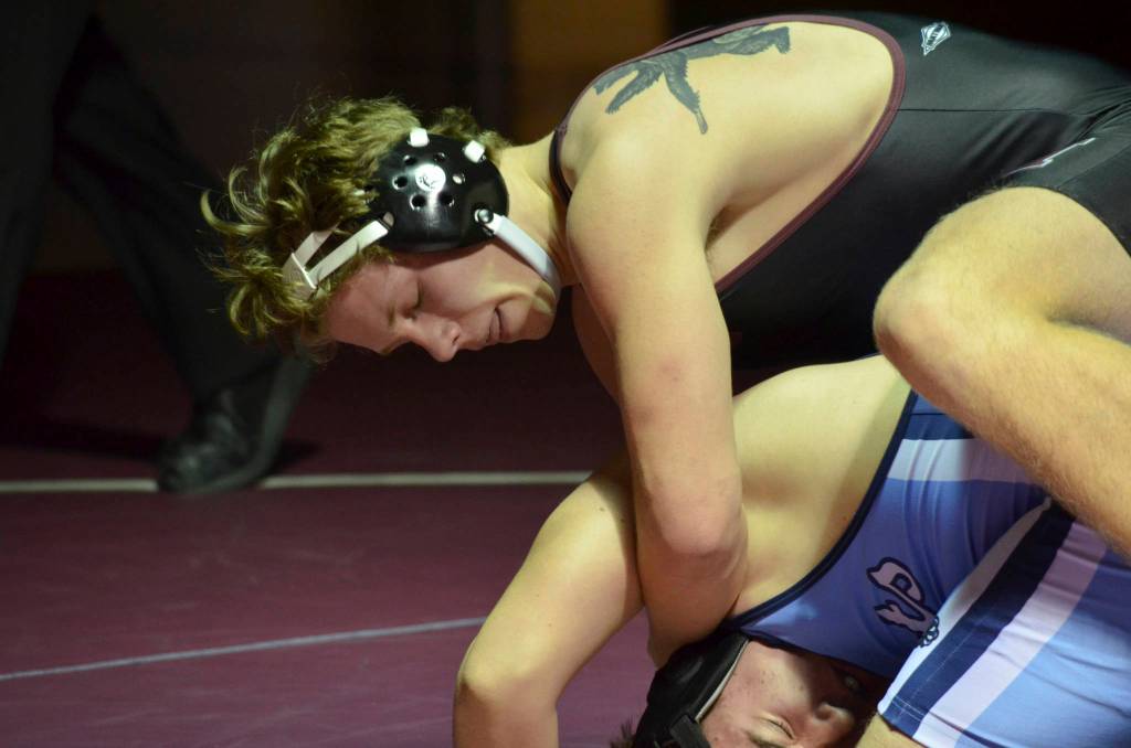 Mercer Island 220-pound wrestler Donnie Howard, pictured, pinned Interlake wrestler Cole Mullenix in their matchup on Jan. 17. The Islanders defeated the Saints 44-24 in the dual match. Photo courtesy of Billy Pruchno