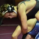 Mercer Island 220-pound wrestler Donnie Howard, pictured, pinned Interlake wrestler Cole Mullenix in their matchup on Jan. 17. The Islanders defeated the Saints 44-24 in the dual match. Photo courtesy of Billy Pruchno