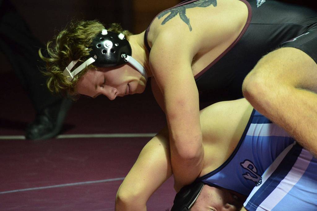 Mercer Island 220-pound wrestler Donnie Howard, pictured, pinned Interlake wrestler Cole Mullenix in their matchup on Jan. 17. The Islanders defeated the Saints 44-24 in the dual match. Photo courtesy of Billy Pruchno