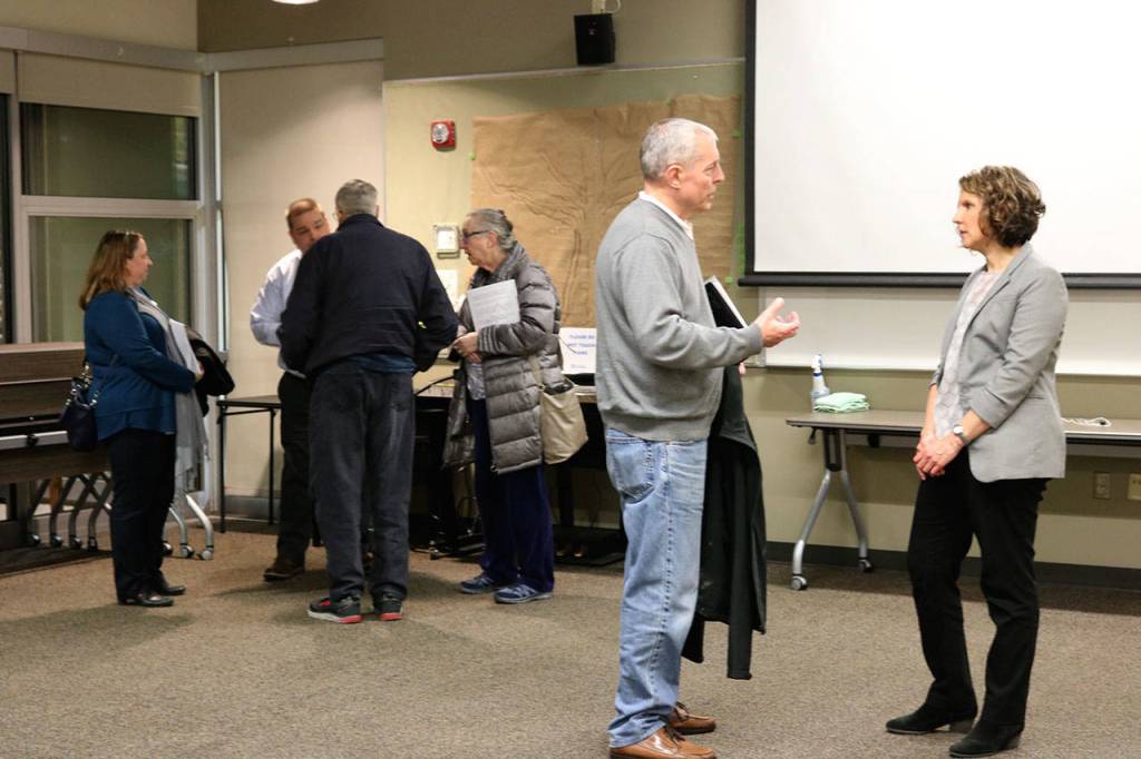 Residents question city staff following a meeting about the new community facilities zone proposed for Mercer Island. Katie Metzger/staff photo