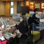 Vasana Monti and Terri Davis of Northwest Artists in Action paint in the lobby of the Mercer Island Community and Event Center. Katie Metzger/staff photo