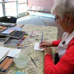 Mercer Island resident Betsy Eason does calligraphy with water soluble pencils at the Mercer Island Community and Event Center on Jan. 26. Katie Metzger/staff photo