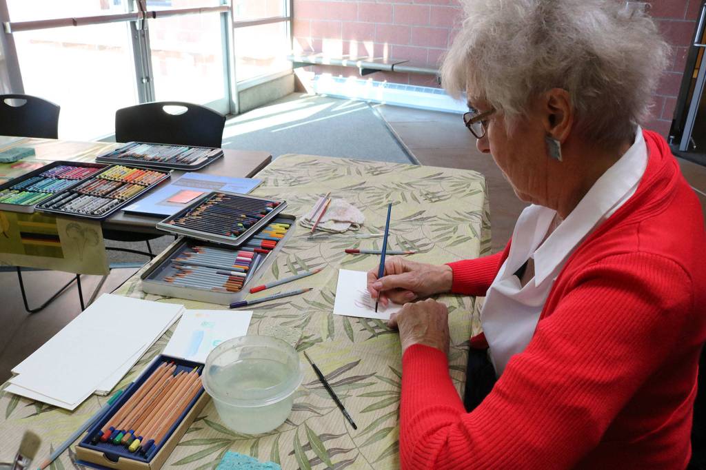 Mercer Island resident Betsy Eason does calligraphy with water soluble pencils at the Mercer Island Community and Event Center on Jan. 26. Katie Metzger/staff photo