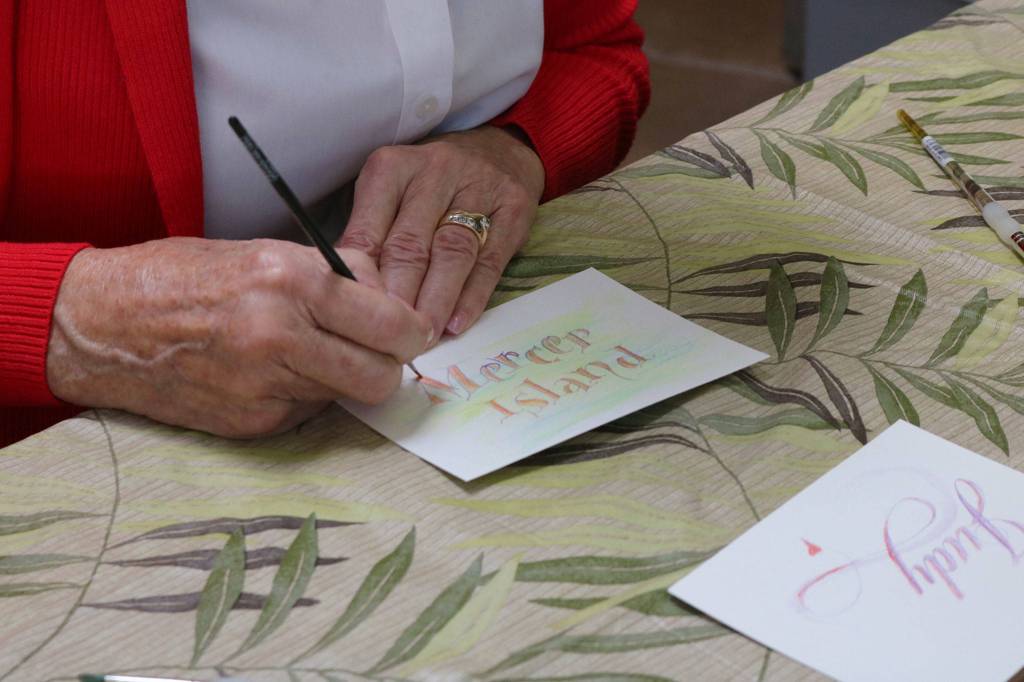 Betsy Eason makes Mercer Island-themed art at a pop-up demonstration for Northwest Artists in Action. Katie Metzger/staff photo