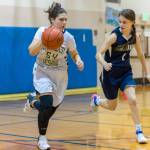 Northwest Yeshiva senior Zohar Hemmet, left, dribbles the ball down the court in the final game of her high school career against Rainier Christian on Jan. 30. Northwest Yeshiva finished the 2018-19 season with an overall record of 4-16. Photo courtesy of Patrick Krohn/Patrick Krohn Photography