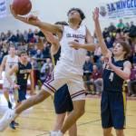 Mercer Island Islanders freshman Chris Clark (pictured) drives to the hoop in the fourth quarter against the Bellevue Wolverines in the 3A KingCo tournament championship game on Feb. 6 at Newport High School in Factoria. The Islanders defeated the Wolverines 44-41. Photo courtesy of Patrick Krohn/Patrick Krohn Photography
