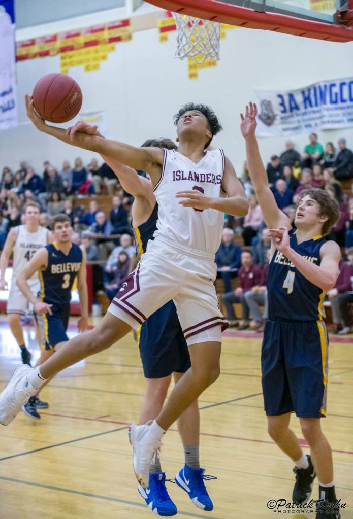 Mercer Island Islanders freshman Chris Clark (pictured) drives to the hoop in the fourth quarter against the Bellevue Wolverines in the 3A KingCo tournament championship game on Feb. 6 at Newport High School in Factoria. The Islanders defeated the Wolverines 44-41. Photo courtesy of Patrick Krohn/Patrick Krohn Photography