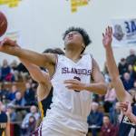 Mercer Island Islanders freshman Chris Clark (pictured) drives to the hoop in the fourth quarter against the Bellevue Wolverines in the 3A KingCo tournament championship game on Feb. 6 at Newport High School in Factoria. The Islanders defeated the Wolverines 44-41. Photo courtesy of Patrick Krohn/Patrick Krohn Photography