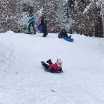 Kate Baxter, 11, speeds down the hill at Rotary Park as her friends prepare to launch into their own descents. Photo courtesy of Meg Lippert