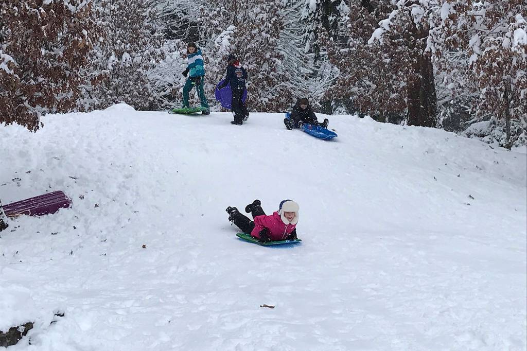 Kate Baxter, 11, speeds down the hill at Rotary Park as her friends prepare to launch into their own descents. Photo courtesy of Meg Lippert