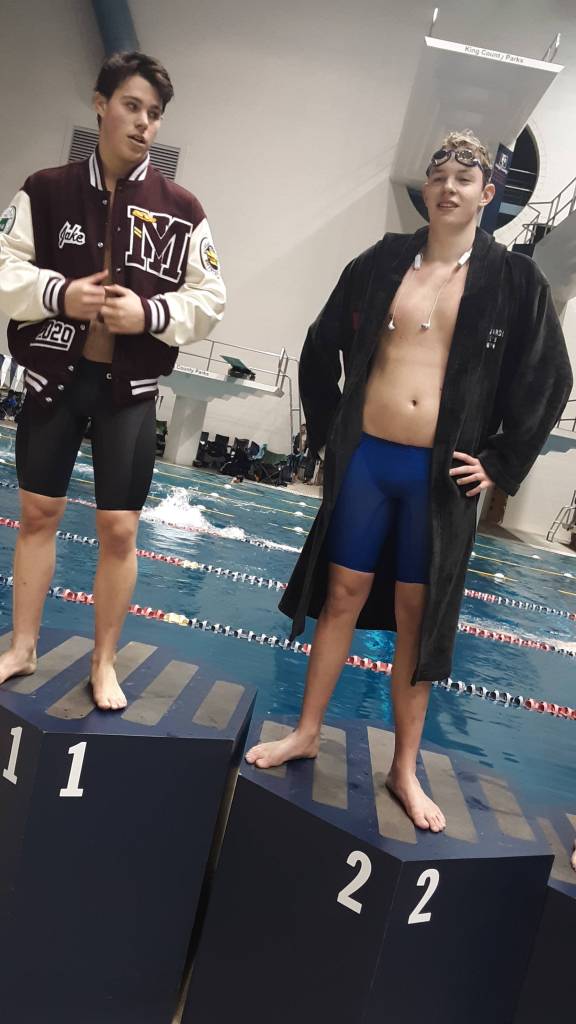 Jake Headrick, left, and Alex Edwards on the 500 free victory podium. Andy Nystrom / staff photo