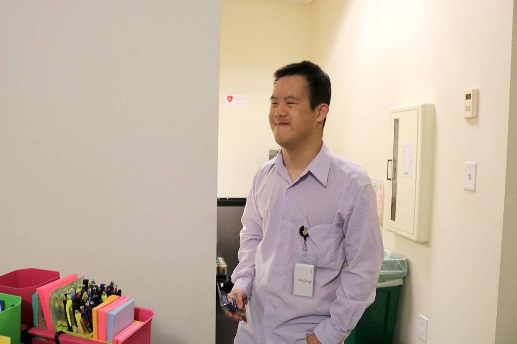 Arthur Hwang is also an AtWork! client hired at the law firm. Hwang works loading paper into printing machines and cleaning the staff room. Stephanie Quiroz/staff photo.