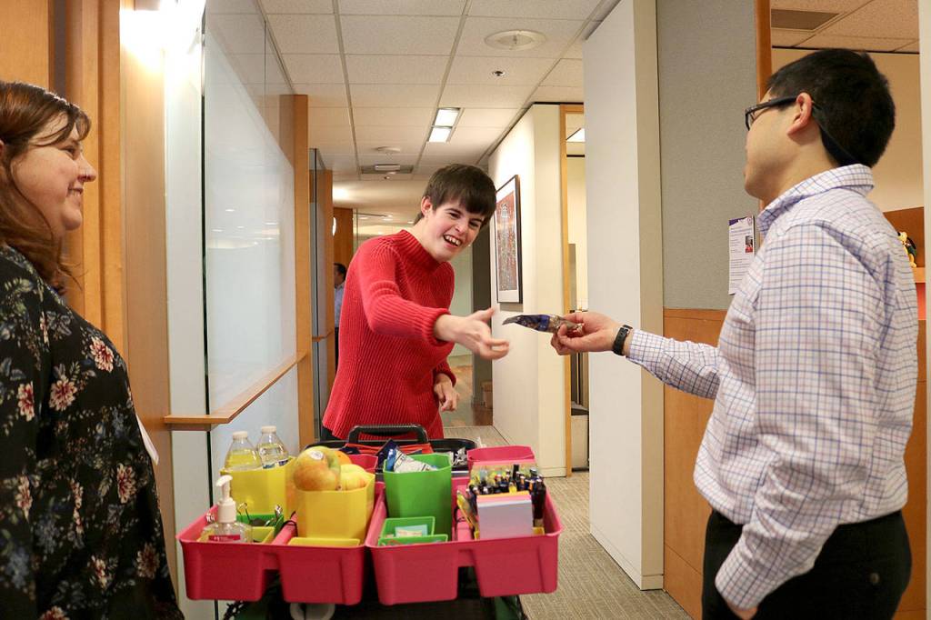 Stephanie Quiroz/staff photo                                Through the supportive employment organization AtWork! Paige Bisbee, 25, was able to find employment at a law firm in downtown Bellevue.
