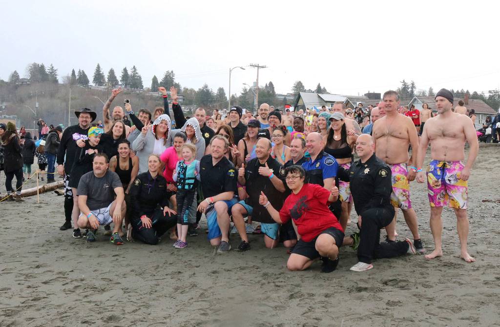 The King County Sheriffs Office team poses for a photo before taking a polar plunge into Puget Sound. Katie Metzger/staff photo
