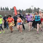 The Redmond Police Department team, wearing swimsuits and costumes, gets ready to take the polar plunge into Puget Sound. Katie Metzger/staff photo