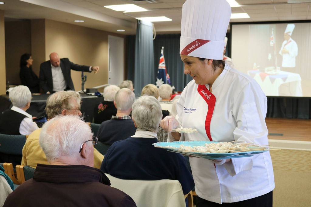 Covenant Shores Chef Laura Gabriel hands out samples of alligator. Katie Metzger/staff photo