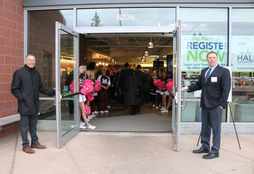 MIYFS middle school counselor Harry Brown and community-based services manager Derek Franklin, along with the Mercer Island Sparkle Squad, welcome attendees to the 2019 breakfast at the Community and Event Center. Katie Metzger/staff photo