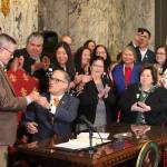 Gov. Jay Inlsee signs into law the Native American Voting Rights Act, which allows a non-traditional address to be used for voter registration for residents who live on reservations. Photo by Emma Epperly/WNPA Olympia News Bureau