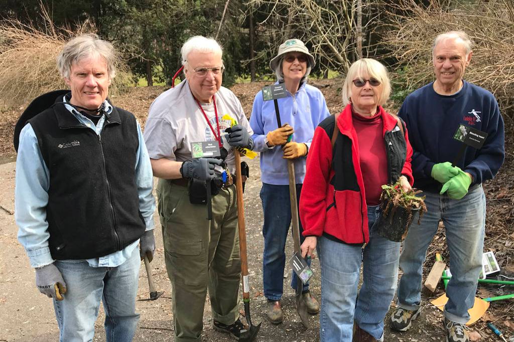 Photo by Meg Lippert                                 Volunteers prepare for planting native species from King County Conservation District in the Mercerdale Park Native Plant Garden. From left, Patrick Daugherty, George and Roberta Lewandowski, Rita Moore and Al Lippert.