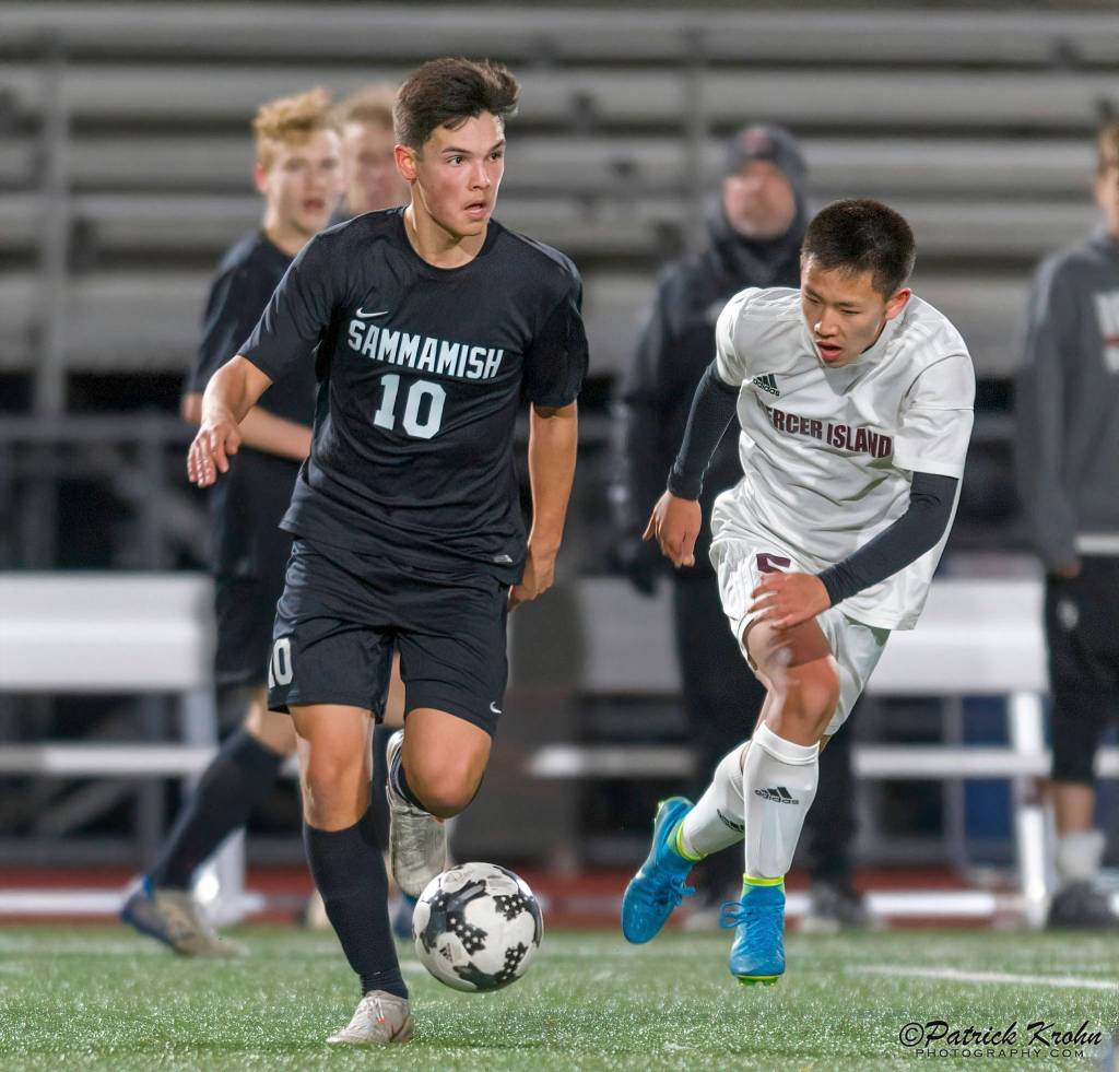 Mercer Island sophomore midfielder Joshua Chang, right, puts pressure on a Totems player on March 26. Mercer Islands stellar defense has surrendered just two goals in six games thus far this season. Photo courtesy of Patrick Krohn/Patrick Krohn Photography