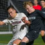 Mercer Island senior forward Dakota Promet, left, and Sammamish freshman Andrew Wilbert, right, battle for possession of the ball on March 26 at Sammamish High School in Bellevue. Mercer Island defeated Sammamish 1-0. Photo courtesy of Patrick Krohn/Patrick Krohn Photography