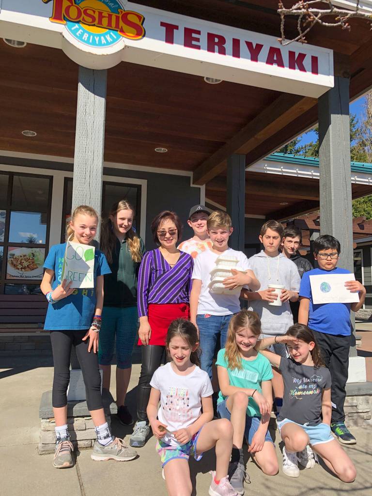 The owner of Toshis Terikyaki on Mercer Island met with members of the Lakeridge student green team, who urged businesses to switch from Styrofoam to recyclable or compostable to-go containers. Photo courtesy of Nancy Weil