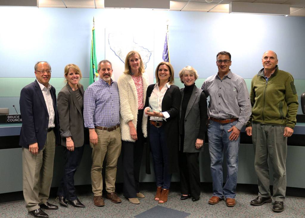 Lisa and Rino Caruccio smile with the Mercer Island City Council after being named Citizens of the Year on April 2. Katie Metzger/staff photo
