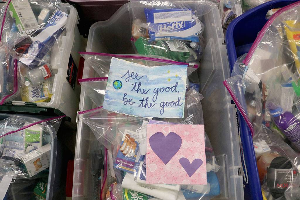 St. Jude Parish members assembled Need Kits with hygiene products at the annual Service Day on March 30. Need Kits were also assembled by elders of 10 assisted living communities. The elderly also donated motivational art cards to put inside each kit. Stephanie Quiroz/staff photo.