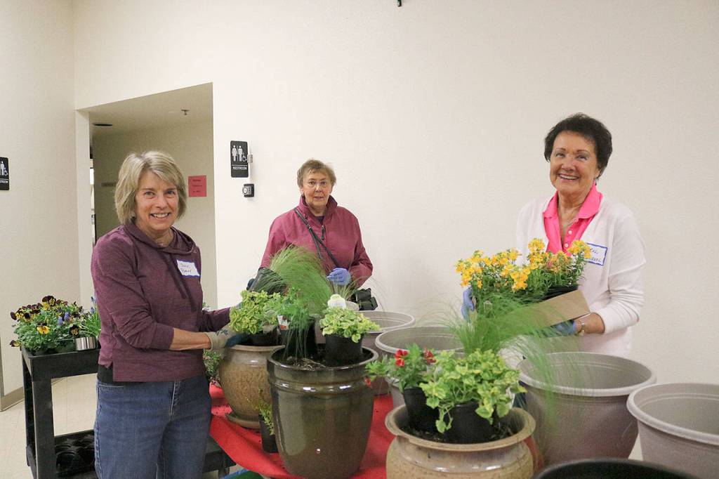 St. Jude Parish members planted flowers and plants for Sophias Way in Bellevue. Stephanie Quiroz/staff photo.