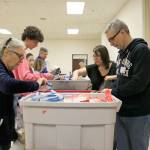 Retail stores in Bellevue, Redmond and Kirkland donated gift cards to purchase items for the hygiene kits and pantry packs. Stephanie Quiroz/staff photo.
