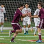 Mercer Island junior midfielder Luca Mtskhetadze, left, celebrates with teammate Jonah Hyman, right, after scoring on a header in the 87th minute of play, giving his team a 2-1 lead in overtime. Mercer Island held on for a 2-1 victory against the Juanita Rebels on April 11. Photo courtesy of Patrick Krohn/Patrick Krohn Photography