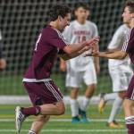 Mercer Island junior midfielder Luca Mtskhetadze, left, celebrates with teammate Jonah Hyman, right, after scoring on a header in the 87th minute of play, giving his team a 2-1 lead in overtime. Mercer Island held on for a 2-1 victory against the Juanita Rebels on April 11. Photo courtesy of Patrick Krohn/Patrick Krohn Photography