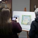 Community members join local government leaders, church officials and workers at the Salt House Church in Kirkland to celebrate the shelter groundbreaking. Locals were able to see designs for the shelter and ask questions of staff. Kailan Manandic/staff photo