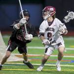 Mercer Island Islanders player Glen Mahony, right, scored three goals against the Eastlake Wolves on May 1. Mercer Island defeated Eastlake 17-4. Photo courtesy of Rick Edelman/Rick Edelman Photography