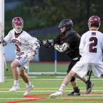 Mercer Island senior Scotty Rowe, left, scored a game-high four goals against the Eastlake Wolves. Mercer Island clinched the No. 1 seed to the playoffs from the KingCo Conference courtesy of its 17-4 victory against Eastlake on May 1. Photo courtesy of Rick Edelman/Rick Edelman Photography