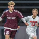 Mercer Island senior Matthew Capone, left, dribbles the ball up field while being guarded by Juanita sophomore Andrew Taylor in a game on April 11. Juanita defeated Mercer Island, 2-1, in a loser-out, 3A KingCo playoff game on May 7 at Mercer Island High School. Photo courtesy of Patrick Krohn/Patrick Krohn Photography