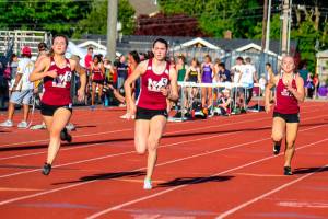 Mercer Island senior Maggie Baker (No. 5) captured first place in the 400 at the 3A KingCo track meet at Lake Washington High School in Kirkland. Photo courtesy of Don Borin/Stop Action Photography