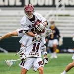 Mercer Island player Glen Mahony (No. 9) leaps on the back of Will Wheeler (No. 14) during the 3A state championship game against the Bellevue Wolverines. Mercer Island defeated Bellevue 14-6 on May 25 at the Starfire Sports Complex in Tukwila. Photo courtesy of Rick Edelman/Rick Edelman Photography