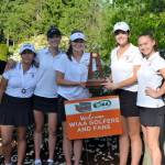 Coach Don Papasedero, Gihoe Seo, Grace Shaddle, Annelise Rorem, Katelyn Travis, Lilly Pruchno and coach Tim Okamura take a team photo with the 3A third place trophy on May 22 at Hawks Prairie Golf Course in Lacey. Photo courtesy of Billy Pruchno