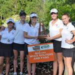 Coach Don Papasedero, Gihoe Seo, Grace Shaddle, Annelise Rorem, Katelyn Travis, Lilly Pruchno and coach Tim Okamura take a team photo with the 3A third place trophy on May 22 at Hawks Prairie Golf Course in Lacey. Photo courtesy of Billy Pruchno