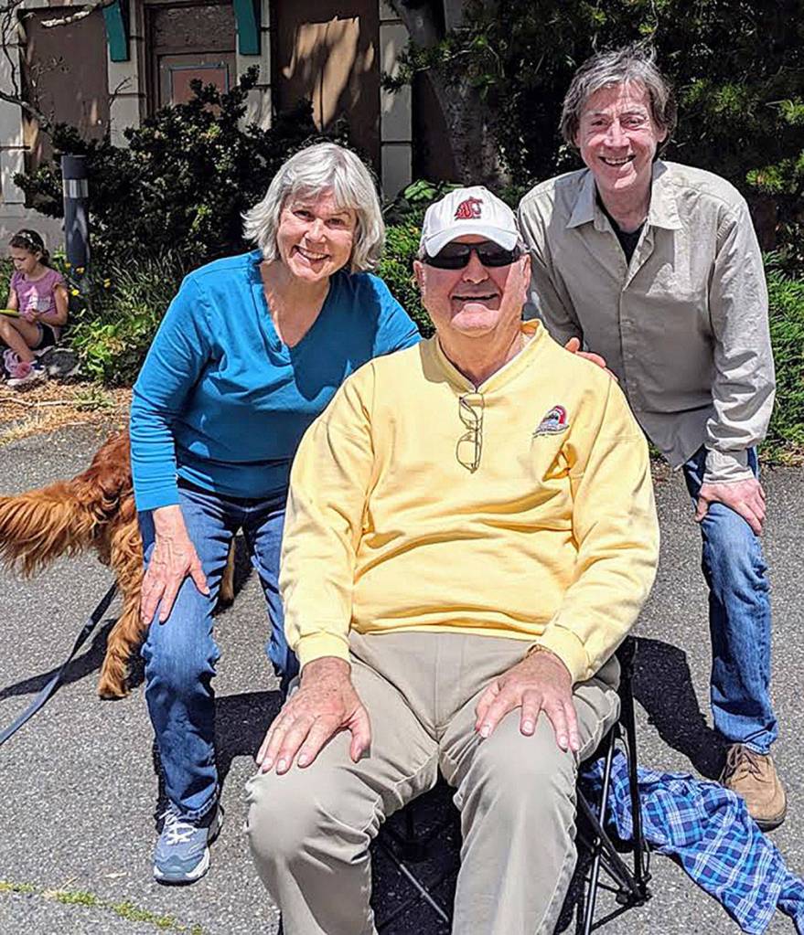 Neil Buhman (center) conducted Kit Malmfeldt and Don Kammerer in playing the schools song. Photo courtesy of Kit Malmfeldt
