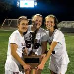 Mercer Island girls lacrosse players Grace Fujinaga, Annabelle Gersch and Hannah Tiscornia hold the state championship trophy following their 10-9 victory against Bainbridge Island in the Washington Schoolgirls Lacrosse Association championship game on May 17. Photo courtesy of Kathy Gersch