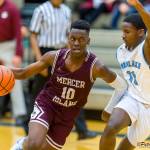 Mercer Island Islanders boys basketball player Nigel Seda, left, drives to the hoop in a game against the Interlake Saints during the 2018-19 season. Seda will be one of four returners to the starting lineup during the 2019-20 season. Photo courtesy of Patrick Krohn/Patrick Krohn Photography
