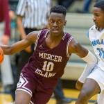 Mercer Island Islanders boys basketball player Nigel Seda, left, drives to the hoop in a game against the Interlake Saints during the 2018-19 season. Seda will be one of four returners to the starting lineup during the 2019-20 season. Photo courtesy of Patrick Krohn/Patrick Krohn Photography