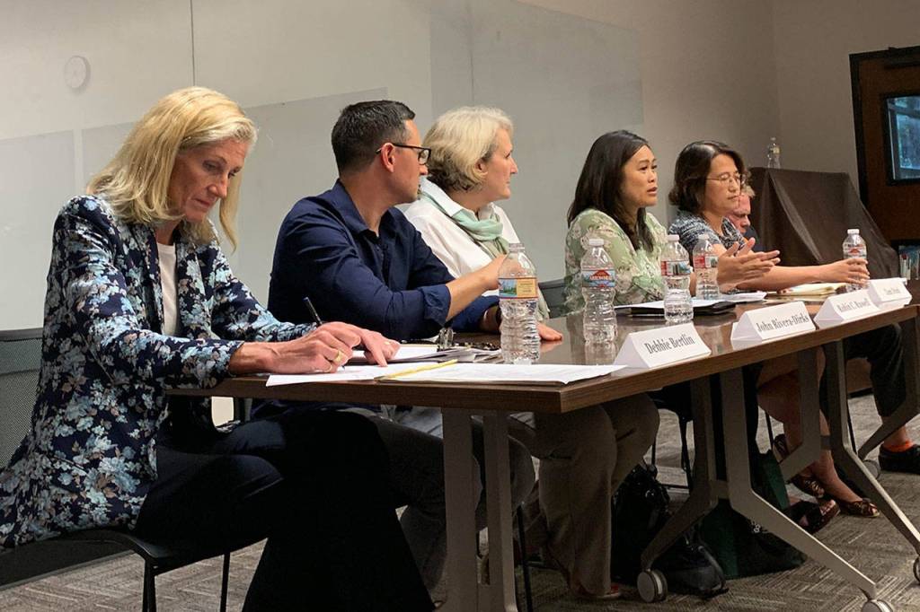 A full room of Mercer Island residents questioned candidates running for City Council Pos. 7 and School Board Pos. 5. Madeline Coats/staff photo                                 Six candidates sat in a panel at Mercer Island Library on July 15. They discussed their various perspectives on issues facing the community. Madeline Coats/staff photo