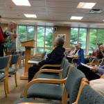Mercer Island seniors sing from their songbooks in the Fellowship Hall at Covenant Living at the Shores on July 17. Madeline Coats/staff photo                                 Pastor Greg Asimakoupoulos and Rotarian Karen Dunning guided the group through 15 songs during the sing-a-long program. Madeline Coats/staff photo