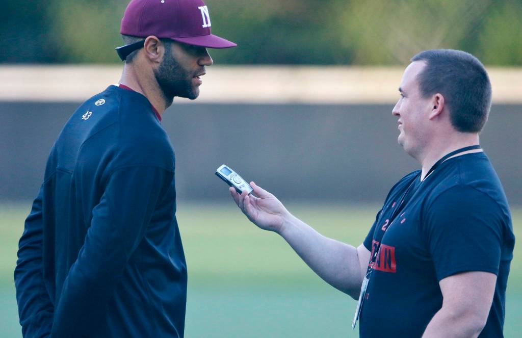 Sound Publishing sportswriter Shaun Scott, right, interviews Dominic Woody following a game against the Interlake Saints in April of 2019. Scott will be leaving Sound Publishing after 59 months on the job. Photo courtesy of Jim Nicholson