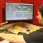 Madison Miller / staff photo                                Max Tanzer prepares 88.9 KMIH The Bridges transformation into Log Boom Radio for Seafair.